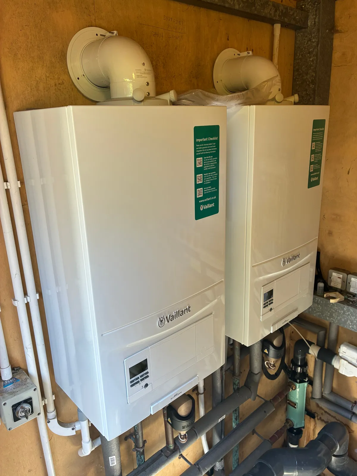 Twin Vaillant combi boilers installed side by side by Comfort Heating Wimbledon