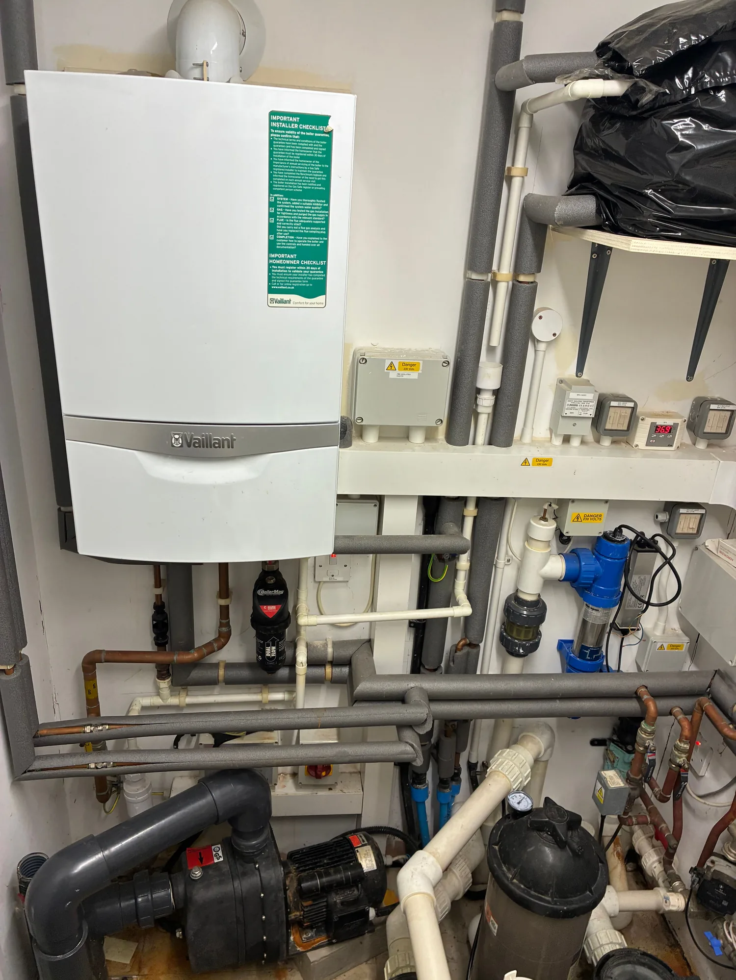 Swimming pool plant room with Vaillant boiler, pumps and filtration